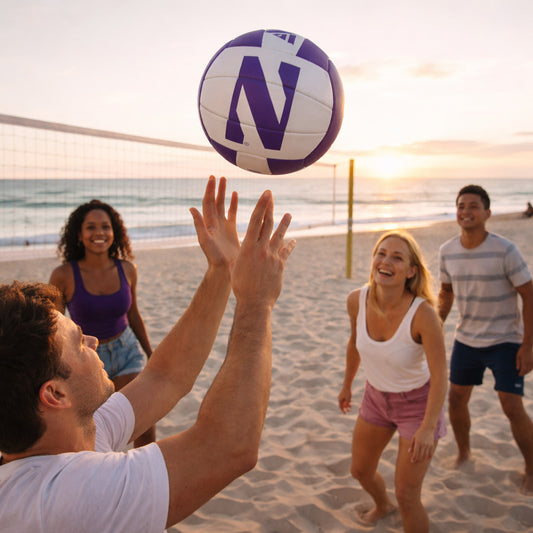 Northwestern Wildcats volleyball in use during a casual beach game at sunset
