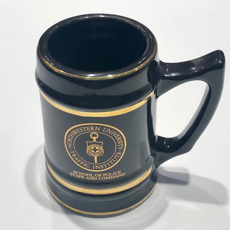 Northwestern Wildcats 32 oz. Black Ceramic Stein with School of Police Staff and Command Design